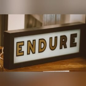Lit light box sign with raised letters
