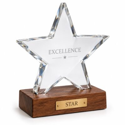 Clear five-point crystal star on wooden base, studio illustration