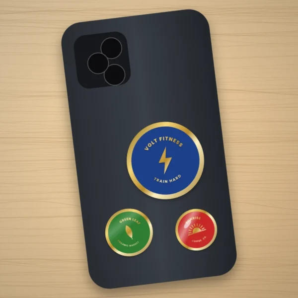 Metal badge stickers on a phone
