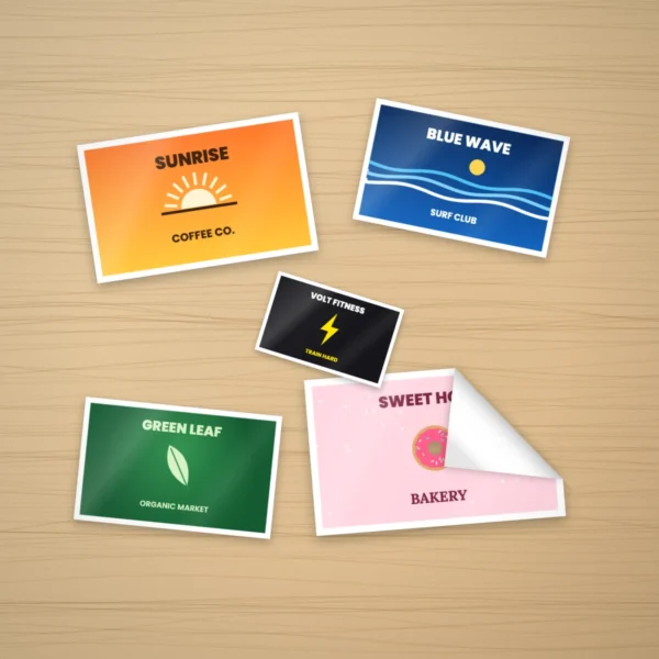 Custom rectangle stickers with logos on a wooden desk